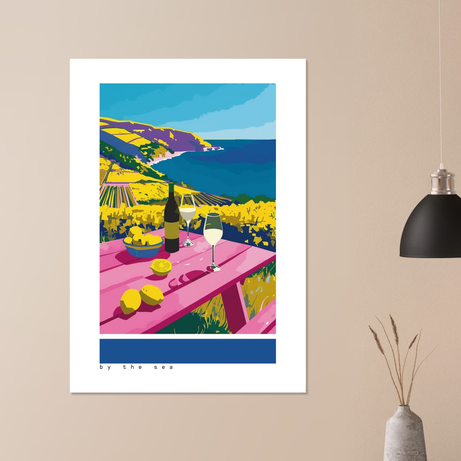 By the Sea print hung above a minimalist bedroom bed, showing a vibrant Mediterranean vineyard scene with wine, lemons, and sunlit sea cliffs. Bold pinks, blues, and greens brighten the neutral décor. Gentle daylight highlights the artwork’s graphic textures, creating a refreshing, cheerful focal point for modern or coastal-inspired interiors.