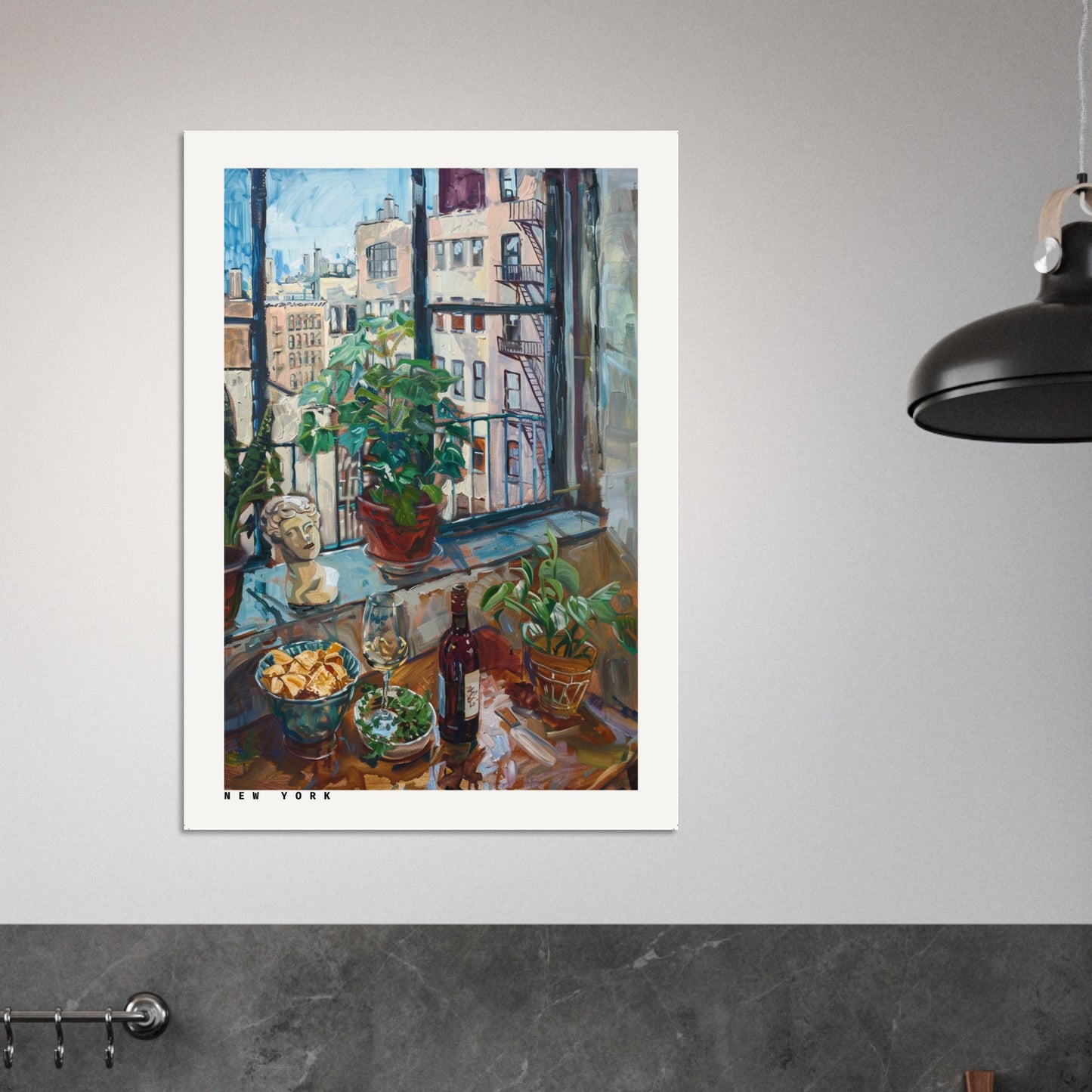 Framed New York Loft Still Life artwork displayed in a modern living room. The print shows a sunlit loft window overlooking Manhattan rooftops with wine, bread, potted plants, and a sculptural bust arranged on the sill. Soft lighting and minimalist décor highlight the artwork’s rich colours, texture, and urban warmth.