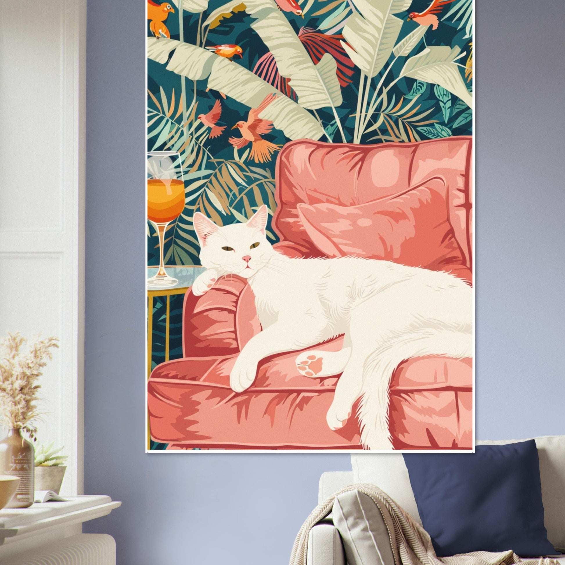 Tropical Lounge White Cat Art Print framed and hung above a neatly made bed in a warm, neutral bedroom. The mockup shows how the artwork’s pink tones, teal leaves, and tropical birds complement soft interior colours, creating a cosy, relaxing atmosphere perfect for bedroom decor or modern home styling.